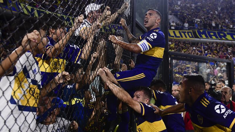 Carlos Tevez celebrates with Boca Juniors fans after scoring the goal to win the league last month. Boca ultras feature heavily in James Montague’s book. Photograph: Gustavo Garello/Jam Media/Getty Images