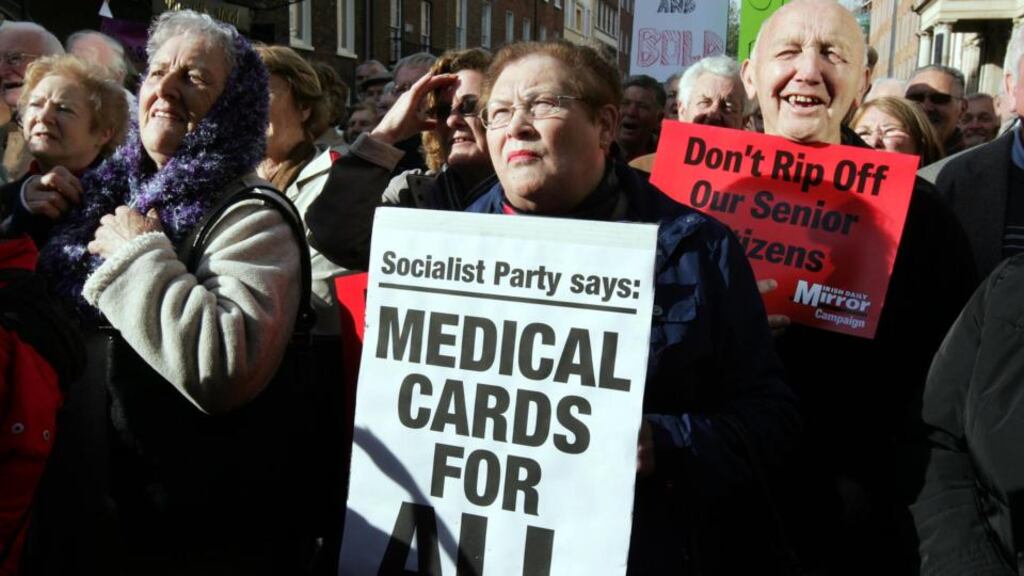 ‘We’ve been down this dubious road of universal entitlement before. Free university fees were sold as the way to get working class kids into college but ended up overwhelmingly subsidising the education costs of the middle classes. The distribution of free medical cards for all over-70s had to be reversed within a decade.’ Above, people taking part in a protest about medical cards for those aged 70 and over, in 2008. Photograph: Eric Luke