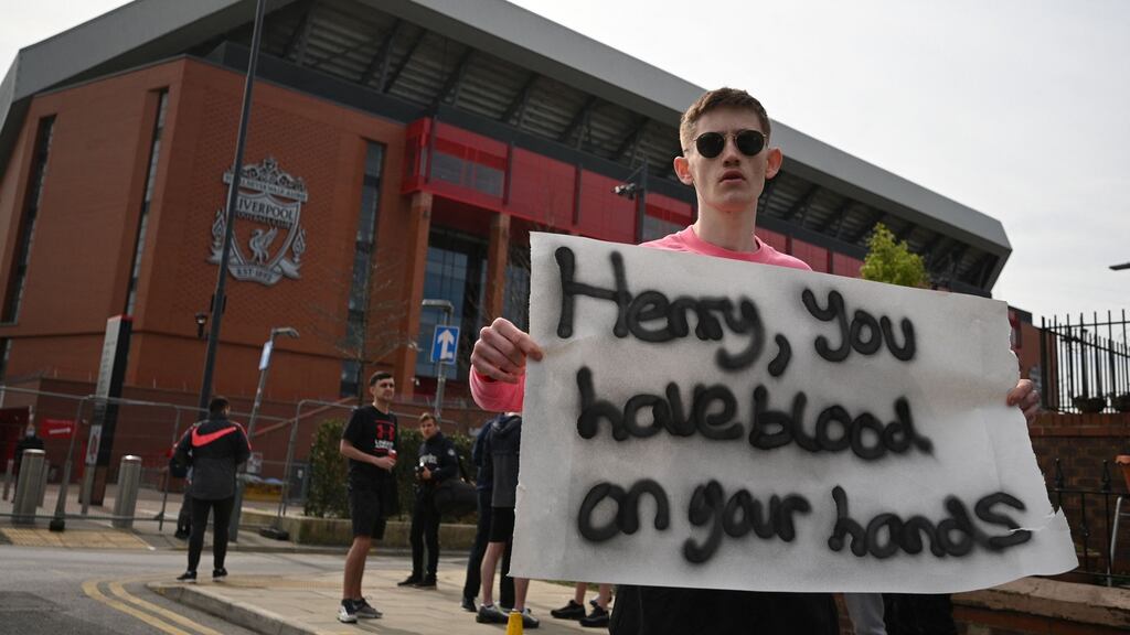 Supporters protest against Liverpool’s US owner John W. Henry and the Fenway Sports Group (FSG) outside the club’s Anfield stadium. Photograph: Oli Scarff/AFP/Getty