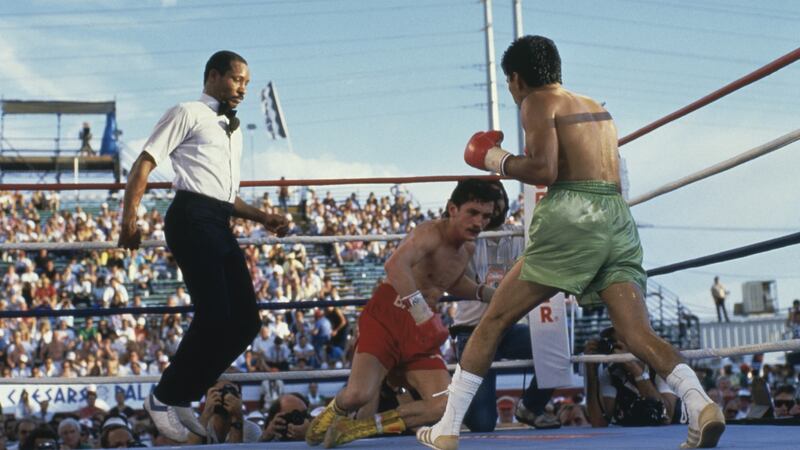 Referee Richard Steele looks on as Irish boxer Barry McGuigan goes down during his defeat to Steve Cruz in the WBA world featherweight title fight against Steve Cruz at Caesars Palace, Las Vegas in 1986. Photo: Mike Powell/Getty Images