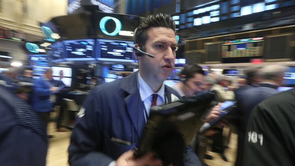 Traders work on the floor of the New York Stock Exchange (NYSE) at the start of the trading day in New York. Photograph: Andrew Gombert/EPA