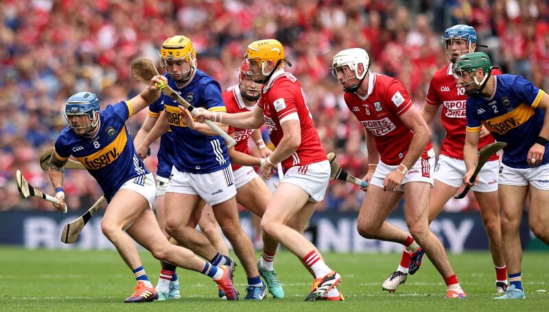 Cork’s Shane Barrett tries to prevent Willie Connors of Tipperary breaking free from the pack. Photograph: Ryan Byrne/Inpho