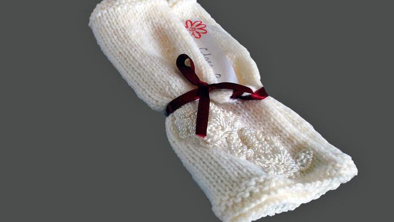WHITE BLANKET: “It felt right to put the wedding ribbon on to her little blanket” – Clare Quinn