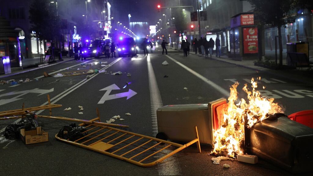 Police break up protesters trying to cut the Gran Via street in Madrid, central Spain, late October 31st 2020. Photograph: Rodrigo Jimenez/EPA