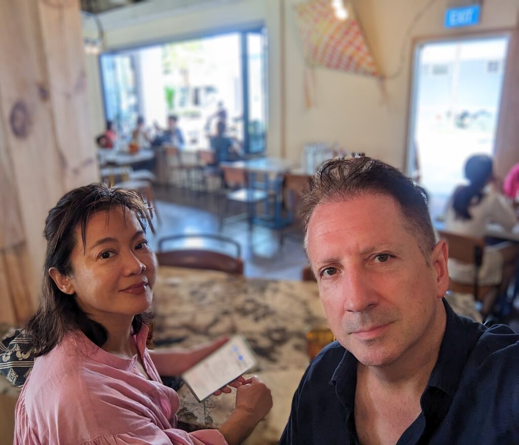 Kerry O’Shea with his Taiwanese wife Peidi at a local cafe in Singapore.