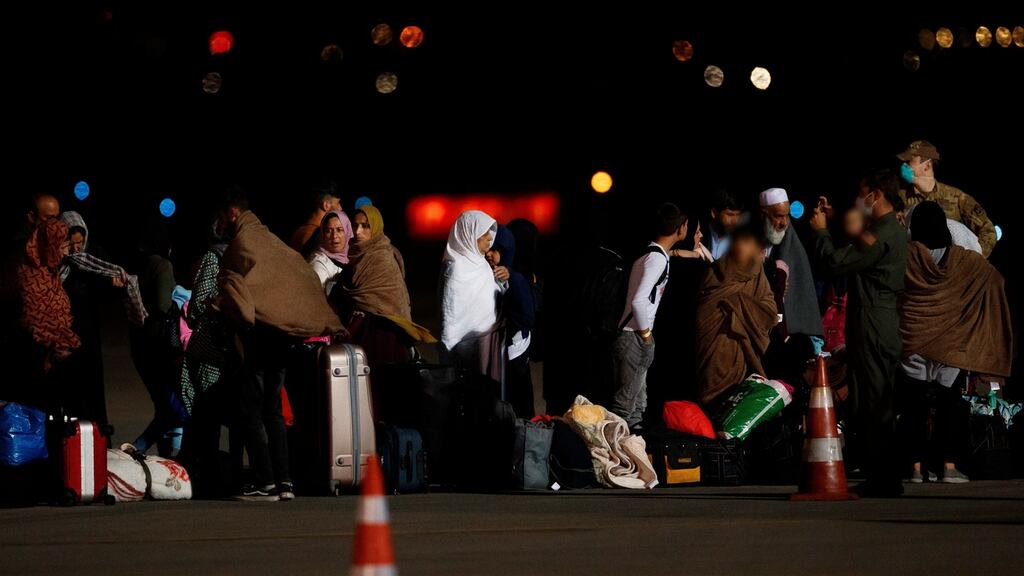 Afghan evacuees arrive at Pristina International Airport in Kosovo on Sunday. Some 60 Irish citizens remain in Afghanistan as well as 15 others who have the right to live in Ireland. Photograph: Valdrin Xhemaj/EPA