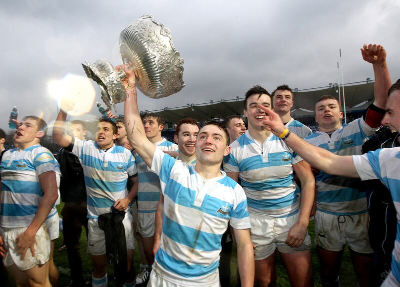 Blackrock's Charlie Rock celebrates with the trophy after Blackrock College's victory over St Michael's College in the 2013 Leinster Senior Cup final. Photograph: Ryan Byrne/Inpho