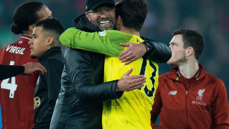 Liverpool manager Jürgen Klopp reacts with Alisson Becker during the match between Liverpool and Newcastle United. Photograph: Peter Powell/EPA