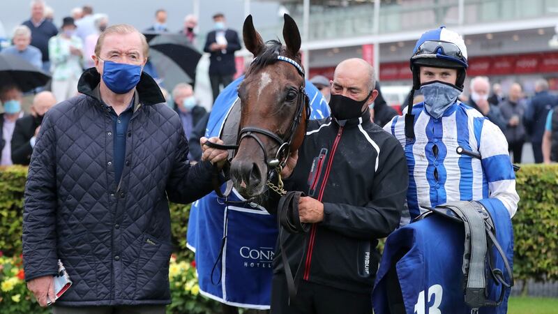 Colter with trainer Dermot Weld and jockey Finian Maguire after winning the Connacht Hotel Handicap. Photograph: Niall Carson/PA Wire