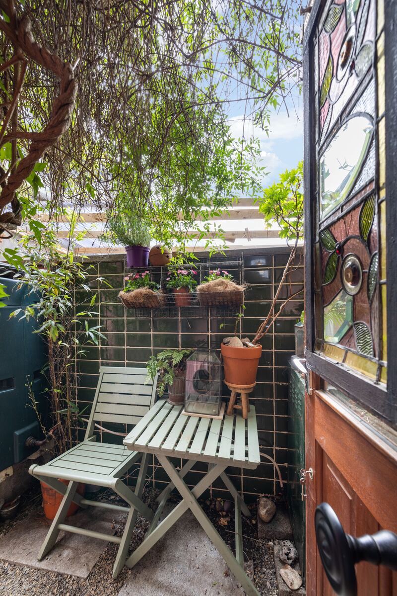 Courtyard with green tile complementing pink walls