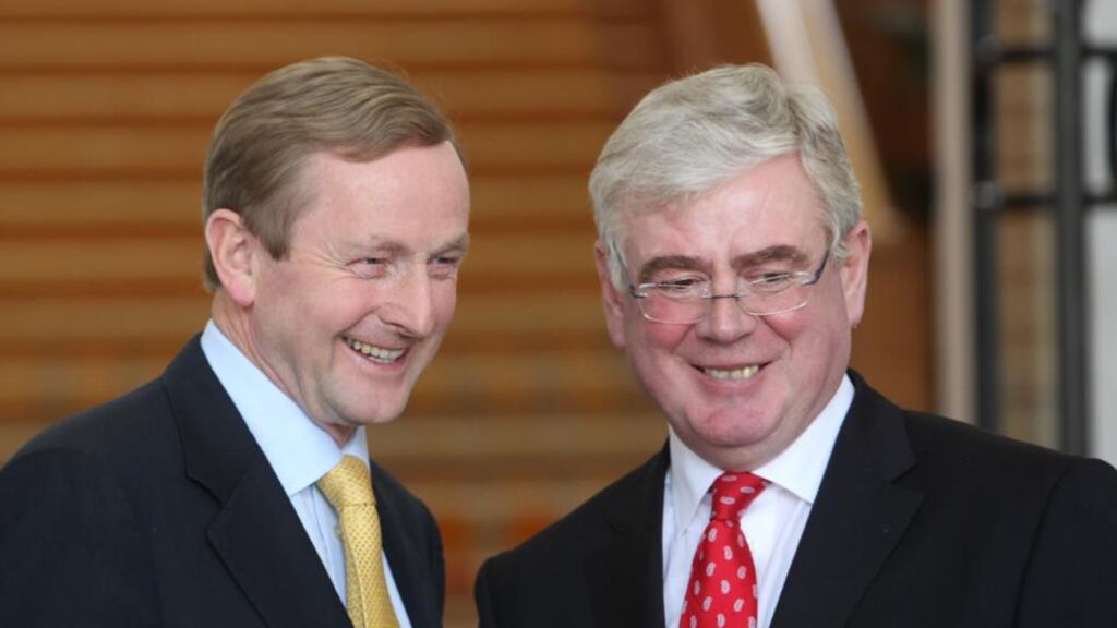 Taoiseach Enda Kenny and Tánaiste Eamon Gilmore picutred during a media briefing to mark the first 100 days of Government at Government Buildings, Dublin in 2011. Photograph: Gareth Chaney/Collins