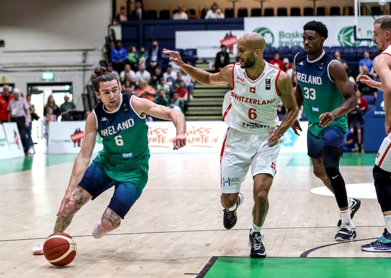 Lorcan Murphy attacks against Kazadi Jonathan in an Ireland v Switzerland FIBA EuroBasket 2025 pre-qualifier at the National Basketball Arena in 2022. Photograph: Dan Sheridan/Inpho