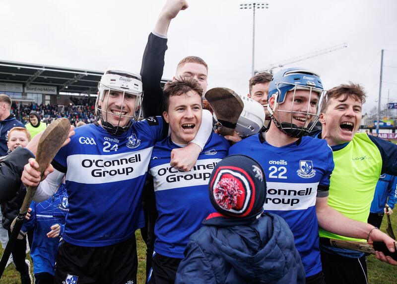 Sarsfields' Killian Murphy, Daniel Kearney and Cathal McCarthy celebrate with fans after the victory over Slaughtneil at St Conleth's Park, Newbridge. Photograph: Ben Brady/Inpho