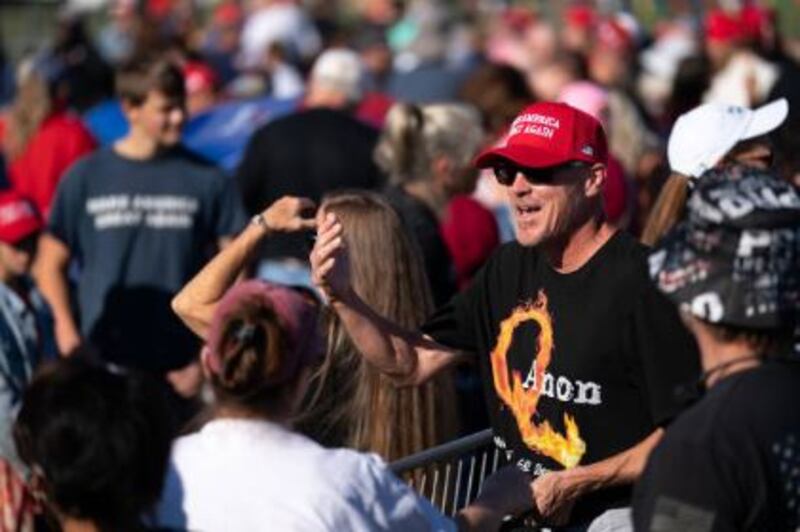 A man wears a Q-Anon T-shirt at a rally by Donald Trump in Georgia, US, in September 2021. Photograph: Getty