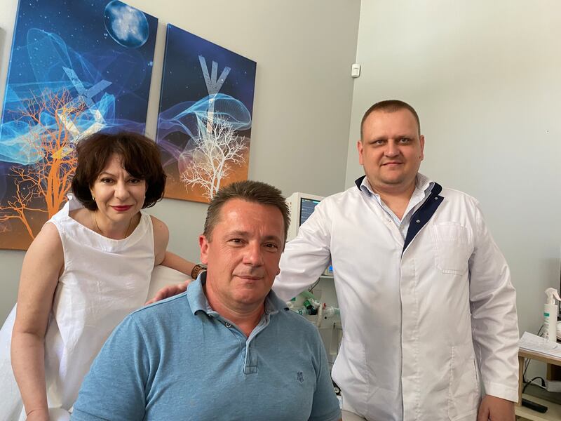 Ukrainian writer 'Grandpa Svyryd' with Xenium clinic director Olena Maryanchyk and anaesthesiologist Serhiy Kalynych: 'You can be a perfect soldier, but when the shrapnel is coming from every direction, you don’t have a chance. Shrapnel hit me in both legs, from behind.' Photograph: Lara Marlowe