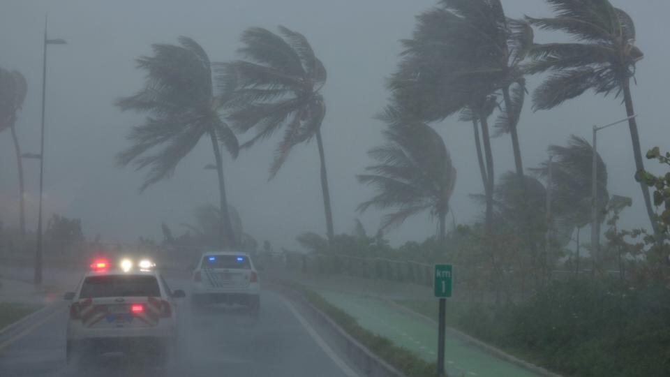 Hurricane Irma: police patrol part of Puerto Rico during the storm on Wednesday. Photograph: Alvin Baez/Reuters