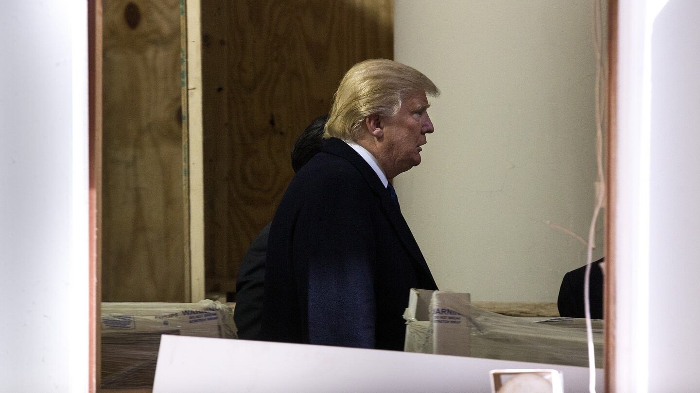 Donald Trump on the site of the Old Post Office building in Washington, which is being developed into a Trump International Hotel. Photograph: Doug Mills/The New York Times