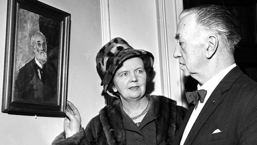 Thomas MacGreevy, a founder member of the Arts Council, and Nora Niland, the curator of the Sligo Museum, with a self-portrait in oils by John Butler Yeats. Photograph: Gordon Standing / The Irish Times