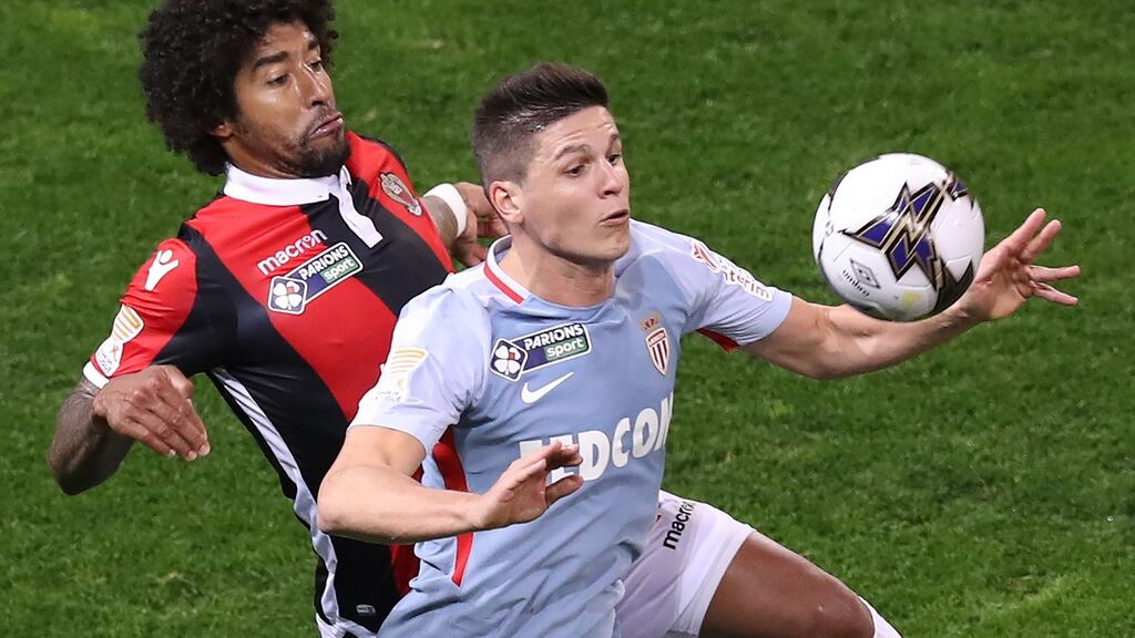 Monaco’s Argentinian forward Guido Carrillo (right) fights for the ball with Nice’s Brazilian defender Dante during a French League Cup football match. Photograph: Valery Hache/AFP/Getty Images