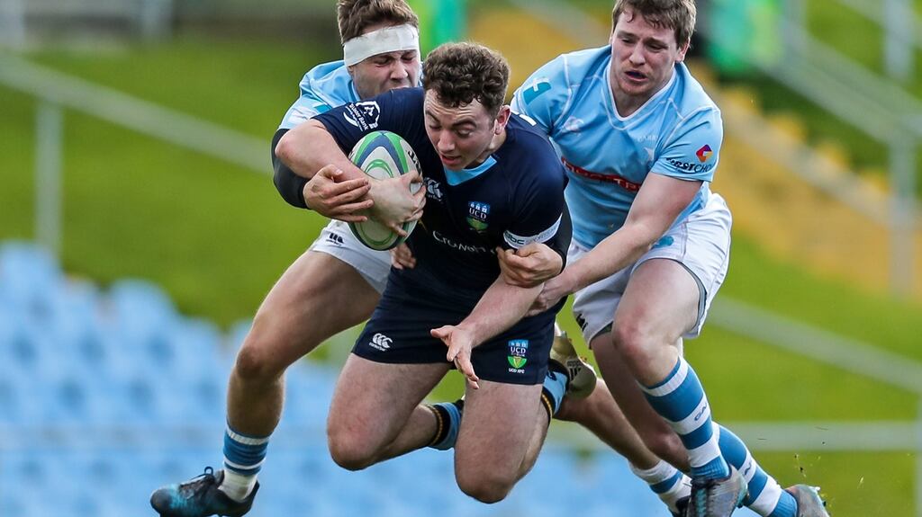 UCD’s Jamie Glynn is tackled by Garryowen’s Neil Cronin in Garryowen’s 17-0 triumph at Belfield. Photograph: Laszlo Geczo/Inpho
