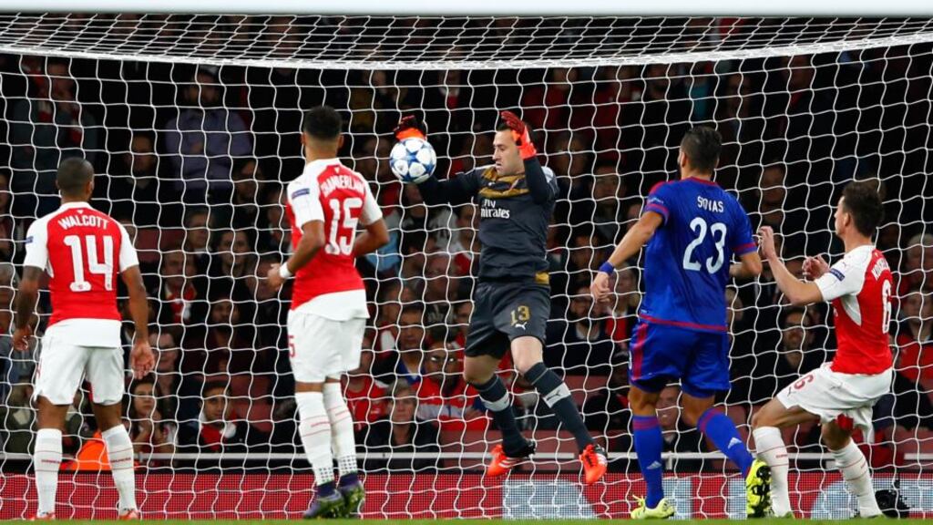 Arsenal goalkeeper David Ospina scores an own goal during the Champions League Group F match against Olympiakos at the Emirates Stadium. Photograph: Shaun Botterill/Getty Images