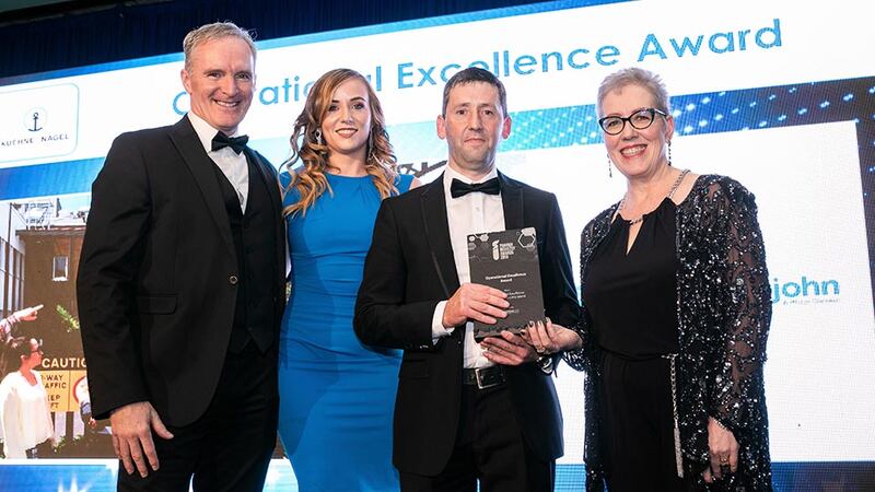 Ann McGee, Managing Director, PharmaLex presents the Operational Excellence Award to the Pfizer Upjohn Little Island team.