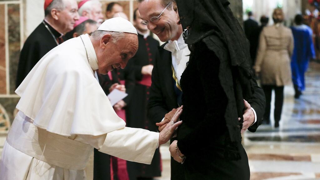 Pope Francis greets an ambassador and his wife during an audience with the diplomatic corps at the Vatican on Monday. Photograph: Alessandro Bianchi/Reuters