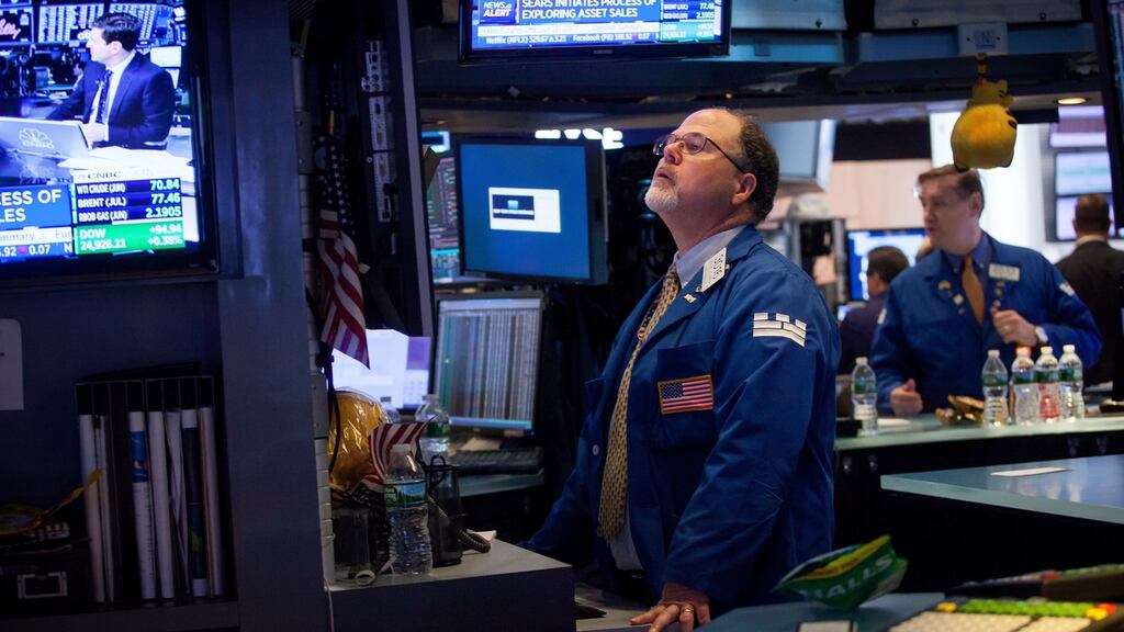 A trader works on the floor of the New York Stock Exchange on Monday. Photographer: Michael Nagle/Bloomberg