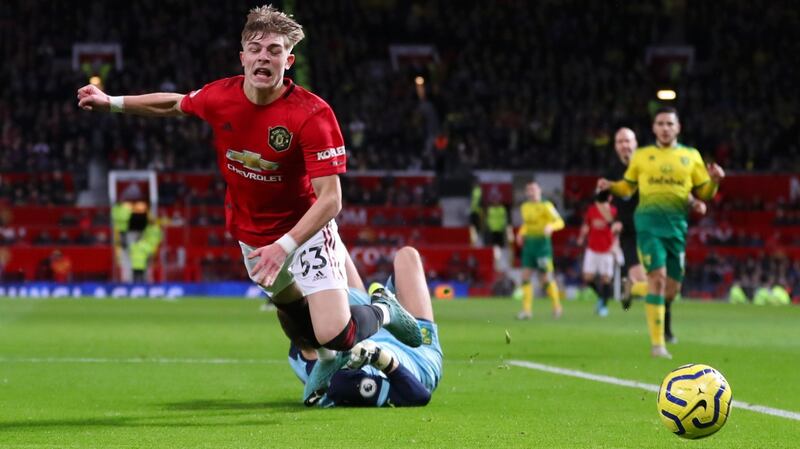 Tim Krul brings down Brandon Williams, gifting Manchester United a penalty against Norwich. Photograph: Catherine Ivill/Getty