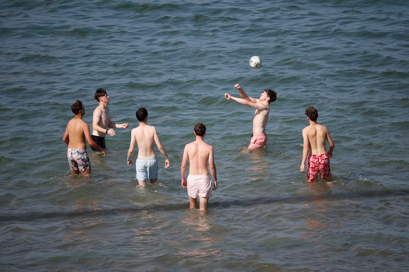 20/06/2025 - News - Swimmers at Seapoint cooling down as afternoon temperatures climbed.  Photograph Nick Bradshaw