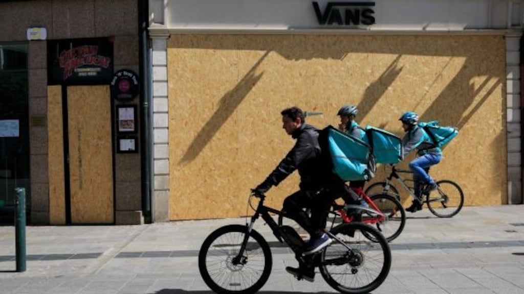 Deliveroo cyclists passing boarded up premises on Grafton Street, Dublin, earlier this year. Photograph: Gareth Chaney/Collins