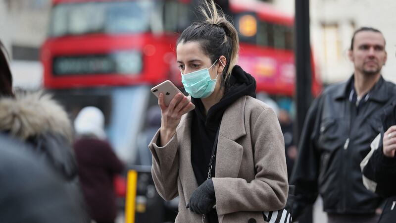A woman wearing a face mask mask in Oxford Street in London. Photograph: Yui Mok/PA Wire