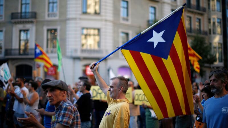 A man holds the pro-independence Catalan flag during a protest in support of Catalonia’s imprisoned politicians, in Barcelona. Photograph: AP Photo/Manu Fernandez