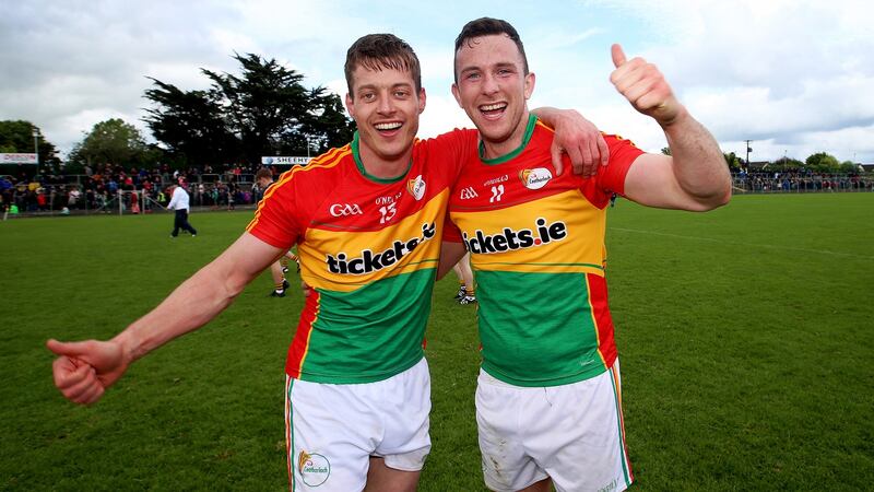 Paul Broderick celebrates Carlow’s win over Wexford with  Darragh Foley. Photograph: Tommy Dickson/Inpho