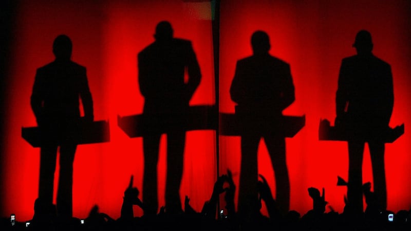 Kraftwerk on stage in 2005. Sometimes the human musicians would exit the stage entirely, replaced by rudimentary robot effigies that ‘performed’ in their place. Photograph: Robert Atanasovski/AFP/Getty Images)