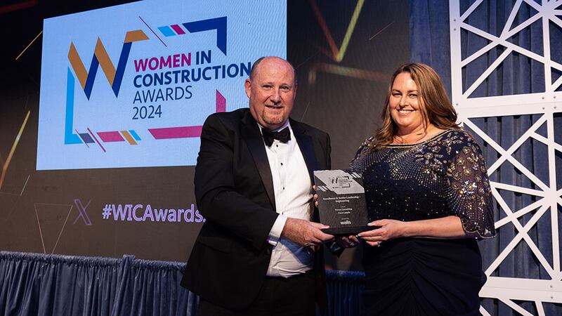 Frank Kelly, chief operations officer, Walls Construction, presents the excellence in senior leadership - engineering award to Ciara Lappin, Doran Consulting