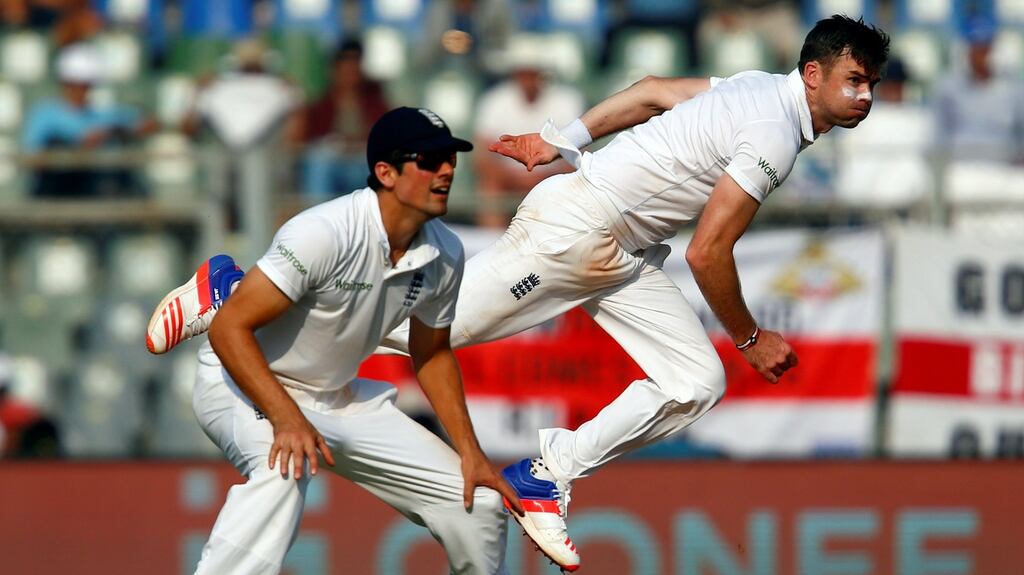 England’s James Anderson (R) bowls as Alastair Cook looks on during day two of the second test against India. Photo: Reuters
