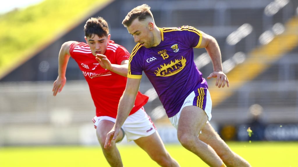 Wexford’s Jonathan Bealin in action against Louth’s Emmet Carolan during the first round of the Leinster SFC last summer. Photograph: Ken Sutton/Inpho