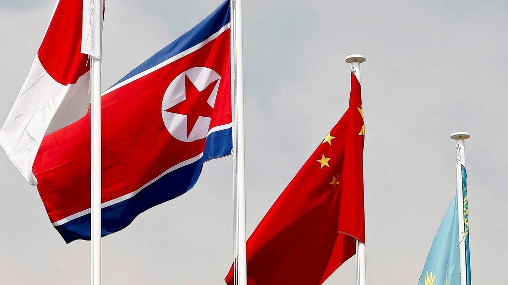 The North Korean and Chinese flags: The Korean nuclear crisis has put China in an awkward position and Beijing repeatedly emphasises its stance calling for talks. Photograph: Jeon Heon-Kyun/EPA