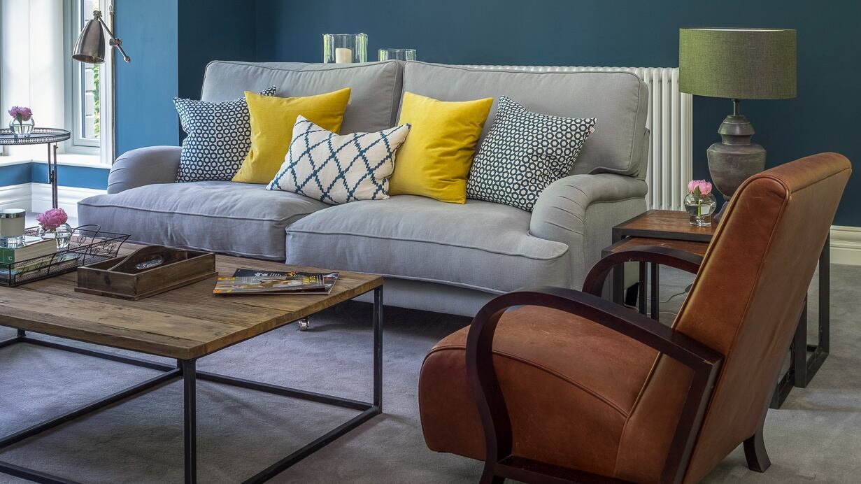 Livingroom after: bold use of blues and aqua-greens bring a hint of seaside to this bungalow reinvention