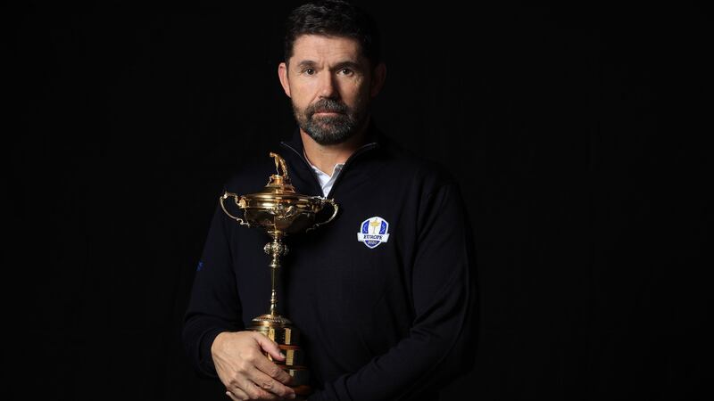 Europe’s Ryder Cup captain Pádraig Harrington poses with the Ryder Cup trophy. Photograph: Andrew Redington/Getty Images