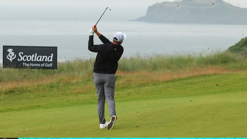 Rahm plays his second shot on the 13th hole at The Renaissance Club. Photo: Andrew Redington/Getty Images