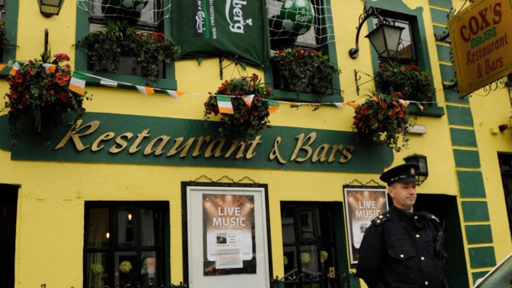 Garda at Cox’s Bar, Castlebar, Co Mayo. Photograph: Keith Heneghan/Phocus