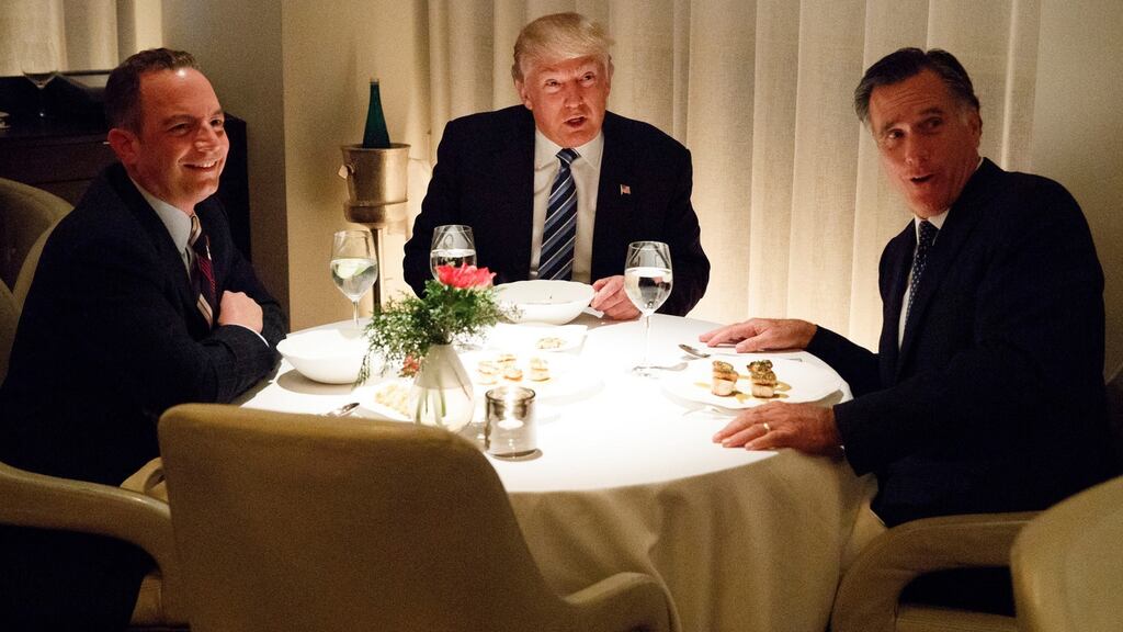 US president-elect Donald Trump dining with Mitt Romney (right) and chief-of- staff Reince Priebus on Tuesday. Photograph: Evan Vucci/AP Photo