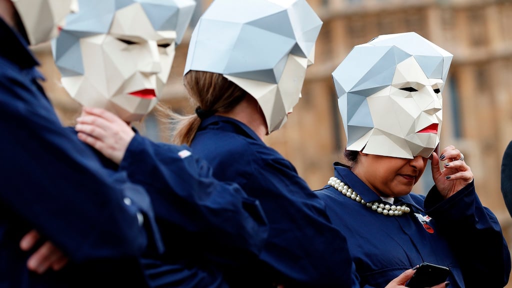 Demonstrators dressed as Britain’s prime minister Theresa May before taking part in a protest on Whitehall outside the entrance to Downing Street in London before Wednesday’s budget. Photograph: Getty