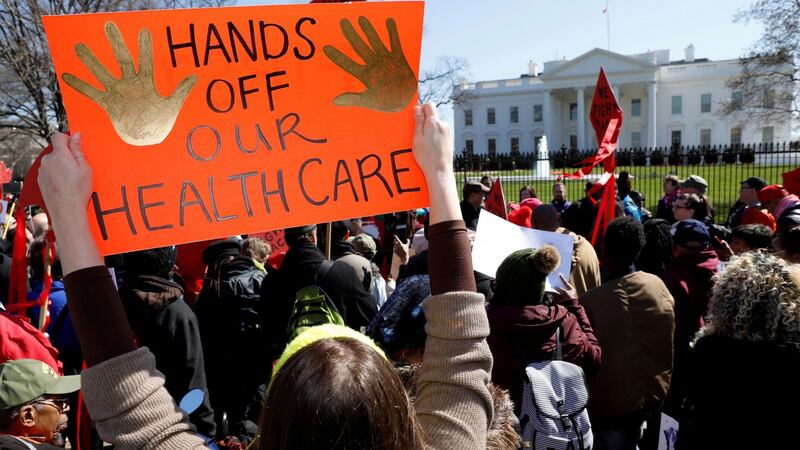 Protesters demonstrate against Donald Trump and his plans to end Obamacare outside the White House on March 23rd. Photograph: Kevin Lamarque/Reuters