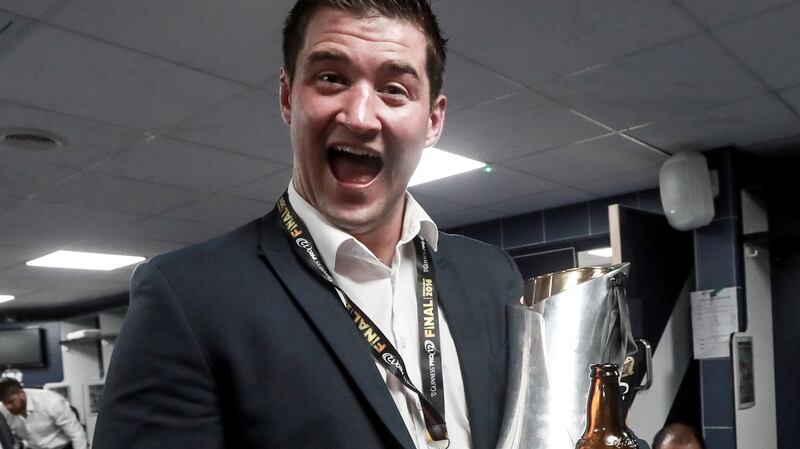 Danny Qualter with the Pro12 trophy in the dressing rooms in Murrayfield. Photograph: Inpho