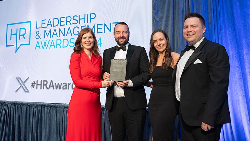 Miriam Manning, awards judge, presents the most effective use of internal communications award to the Boots team