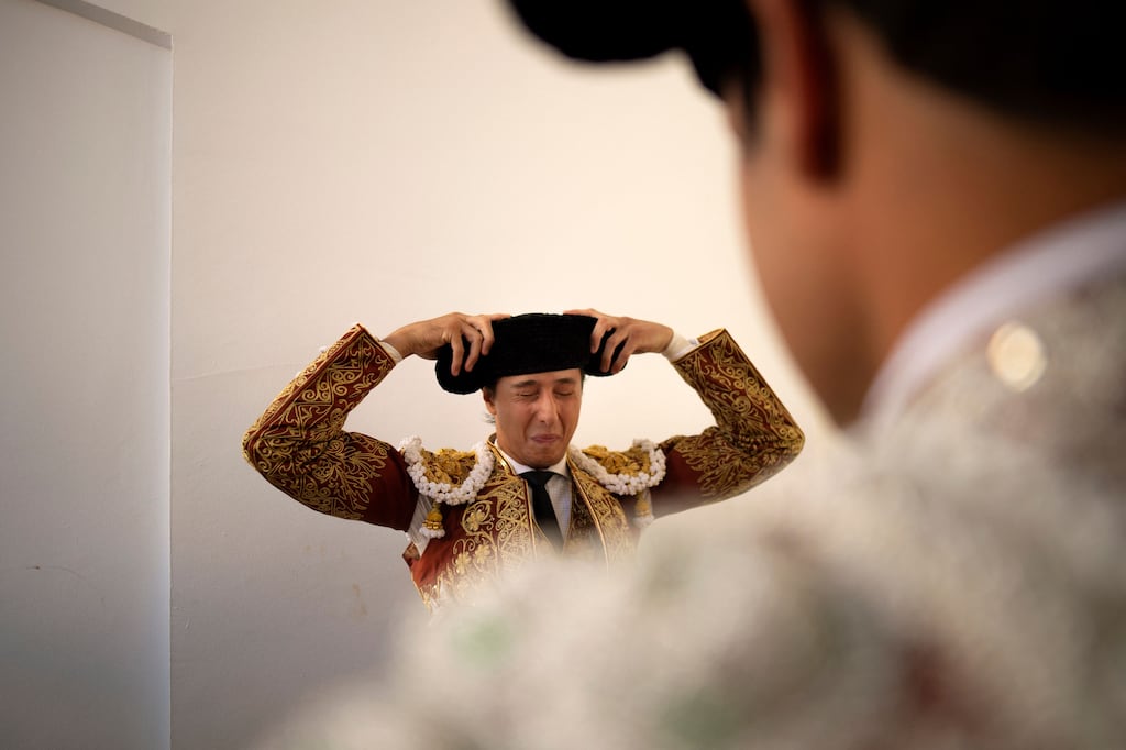 Peruvian matador Andres Roca Rey fits his montera before a bullfight at the Malagueta bullring in Malaga. Photograph: Jorge Guerrero/AFP via Getty Images