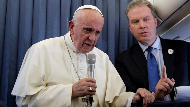 Pope Francis speaks with the media onboard a plane during his flight back to Rome from Dublin last night. Photograph: Gregorio Borgia/Pool via Reuters.